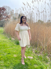 Load image into Gallery viewer, Puff Sleeve Mini dress with pockets. Feels and looks like linen in person, such a beautiful and easy dress to wear! The babydoll silhouette is flattering on all body types!
