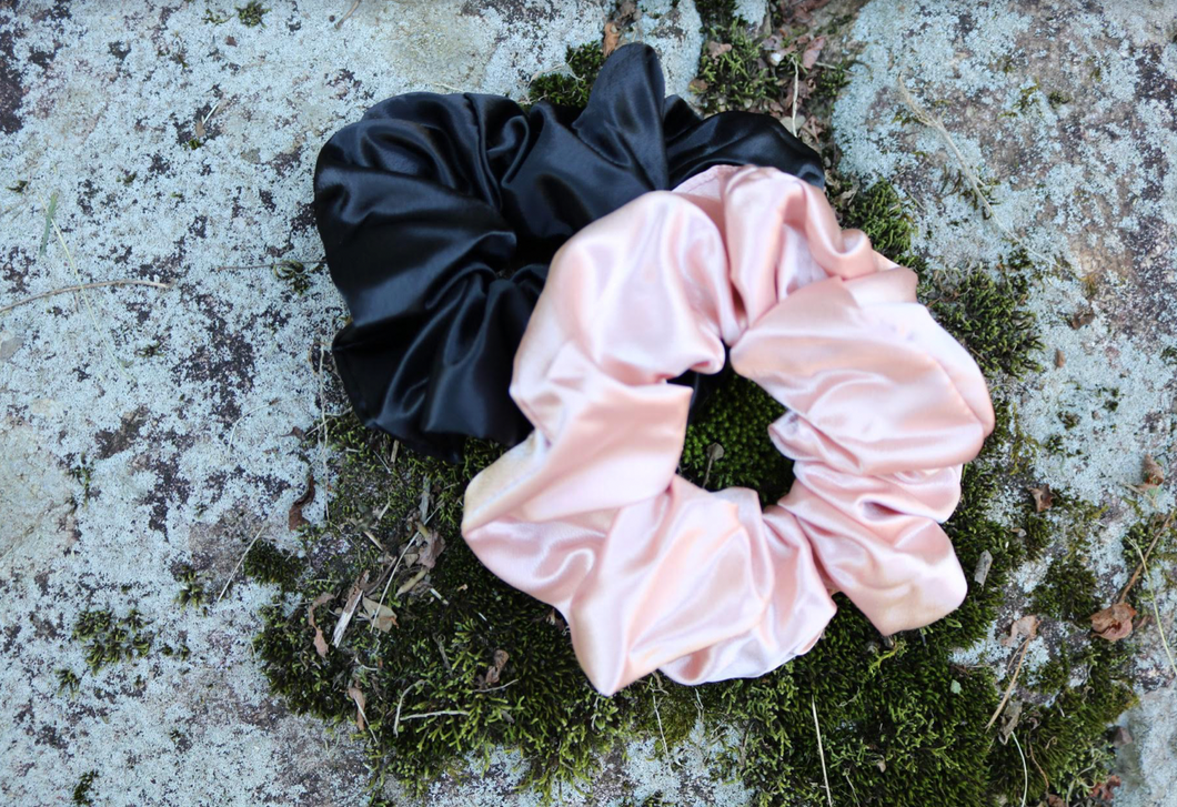 Scrunchies will always be our favorite accessory! This set comes with a black and blush scrunchie! The inner is elastic. These are the perfect hair accessory to keep on your wrist that will still look cute!!